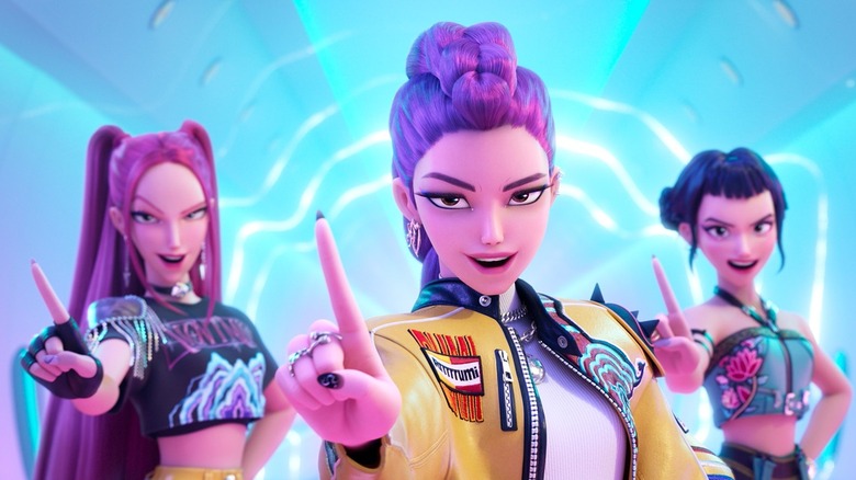 Rumi, Mira, and Zoey waving their fingers in KPop Demon Hunters