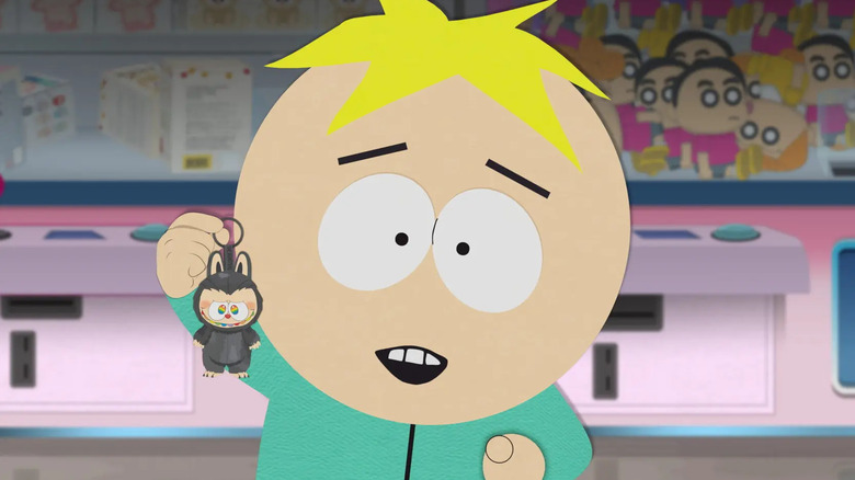 Butters enthusiastically holding a Labubu in South Park