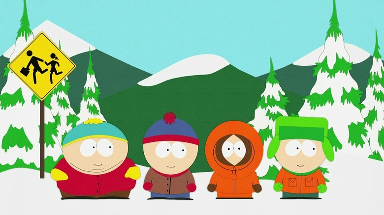 Eric, Stan, Kenny and Kyle wait at the bus stop smiling on South Park