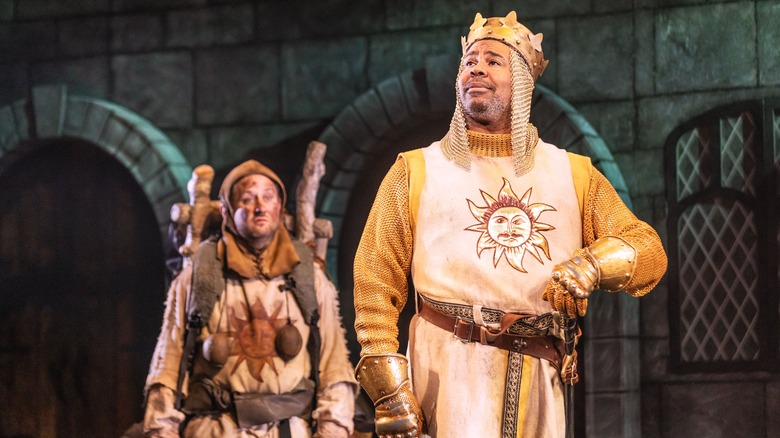 Spamalot's King Arthur (James Monroe Iglehart) posing, with Patsy ((Christopher Fitzgerald) observing