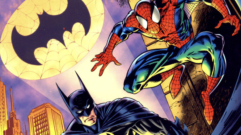 Batman and Spider-Man pose side by side with the Bat-signal in the background on the cover of Spider-Man and Batman