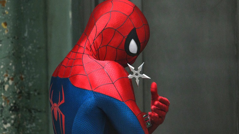 Spider-Man with a throwing star in his shoulder in Spider-Man: Brand New Day