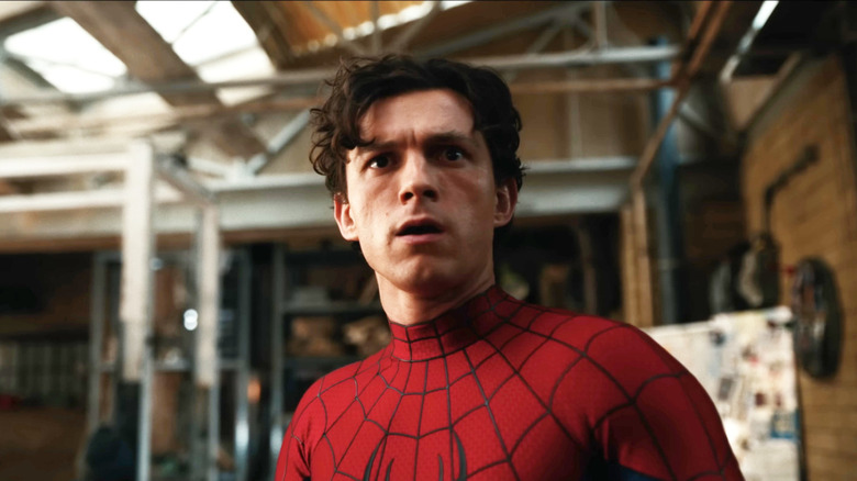 Tom Holland as Spider-Man standing in his apartment with a look of surprise on his face in Spider-Man: Brand New Day