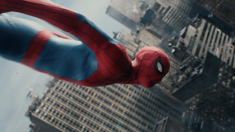 Tom Holland as Peter Parker wearing his superhero suit and falling through the air in New York City in Spider-Man: Brand New Day