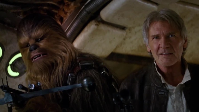 Chewbacca and Han Solo walking onto the Millennium Falcon for the first time again in Star Wars: The Force Awakens