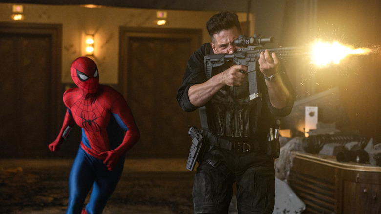 Peter Parker moving behind Punisher as he shoots a rifle in Spider-Man: Brand New Day
