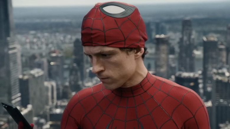 Peter Parker (Tom Holland) staring sadly at his phone in Spider-Man: Brand New Day