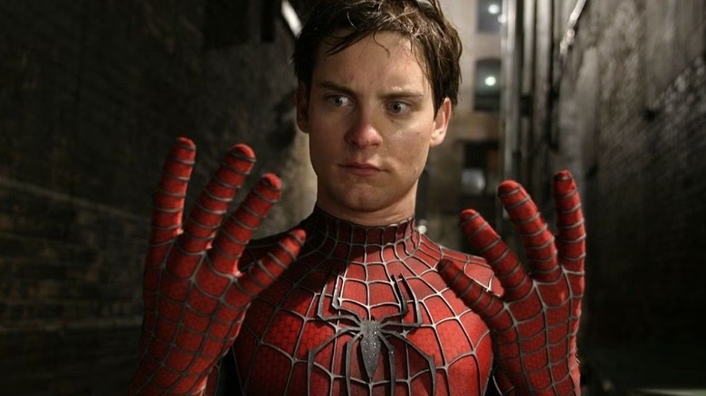 Spider-Man (Tobey Maguire) looking at his hands in Spider-Man 2