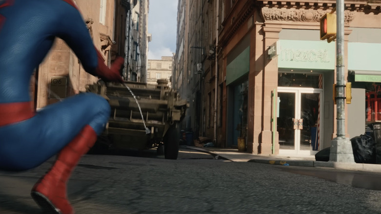 Spider-Man shooting a tank with his webs as it races through an alley in Spider-Man: Brand New Day
