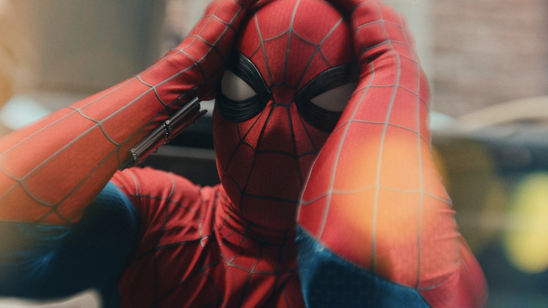 Tom Holland as Spider-Man grabbing his head in Spider-Man: Brand New Day