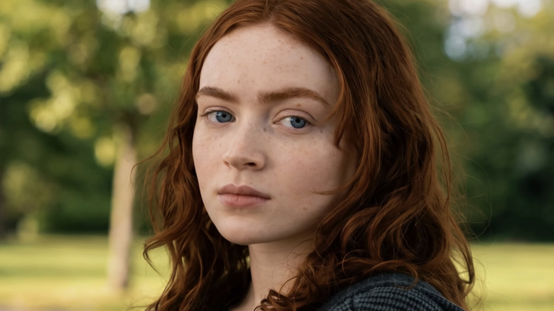 Sadie Sink's Jean Grey sits in a park in Spider-Man Brand New Day