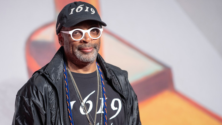 Spike Lee wearing white glasses