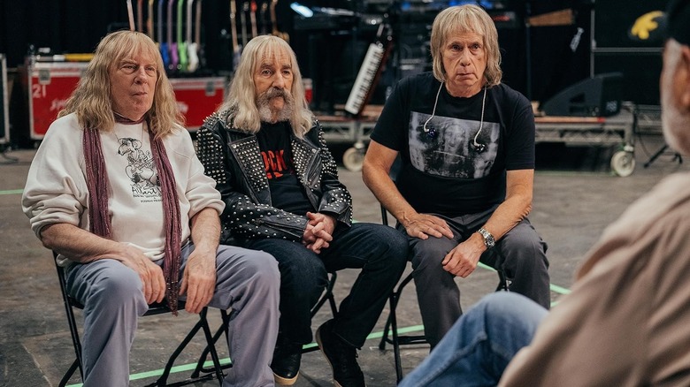 The members of Spinal Tap sitting down for an interview in Spinal Tap 2: The End Continues