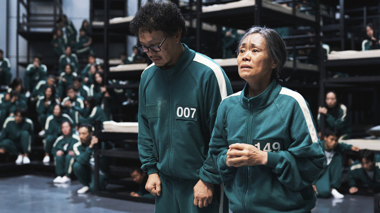 Yang Dong-geun as Park Yong-sik and Kang Ae-sim as Jang Geum-ja in Squid Game season 2