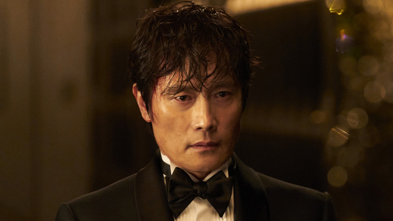 Lee Byung-hun as the Front Man serving as Player 132 on Squid Game