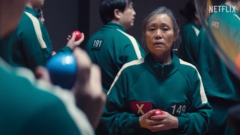 Geum-ja (Kang Ae-shim) and Yong-sik (Yang Dong-geun) stare at each other in Squid Game season 3