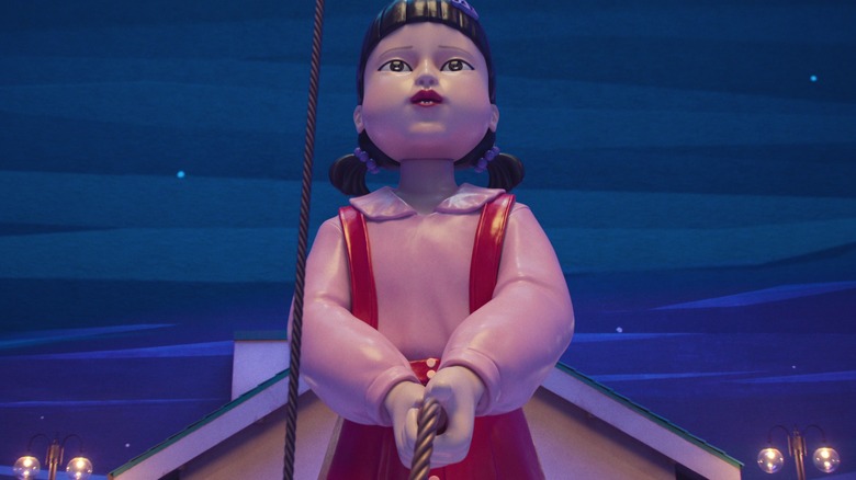 The big Young-hee doll holds one end of the rope in Squid Game