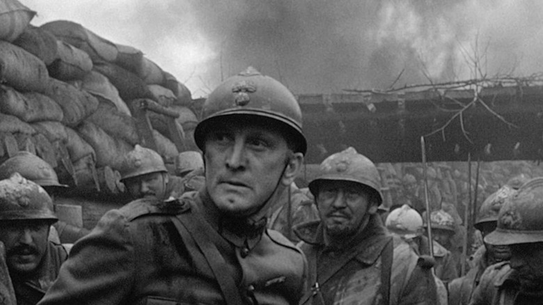 Colonel Dax (Kirk Douglas) stands in the trenches with his troops in Paths of Glory