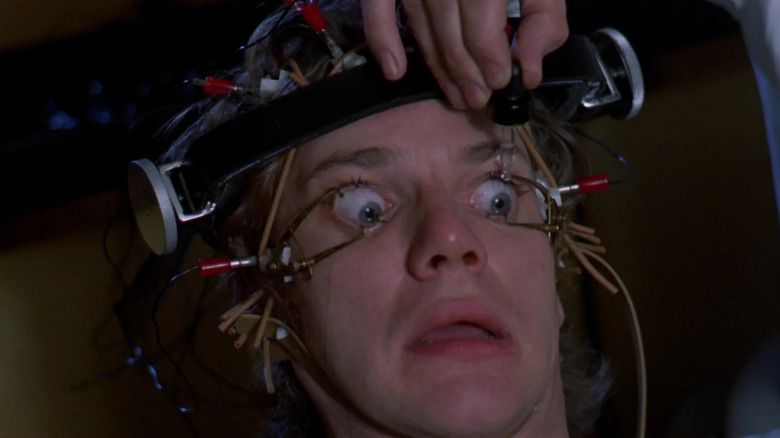 Alex with his eye clamped open, terrified in A Clockwork Orange