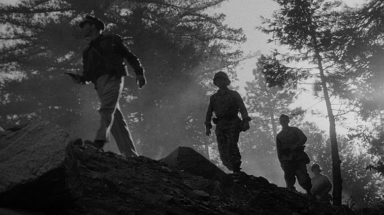 Four soldiers, walking on a ridge in Fear and Desire
