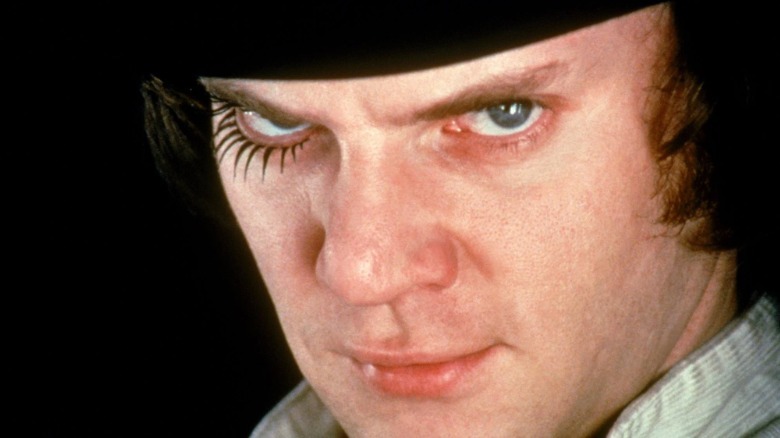 Malcolm McDowell smirking
