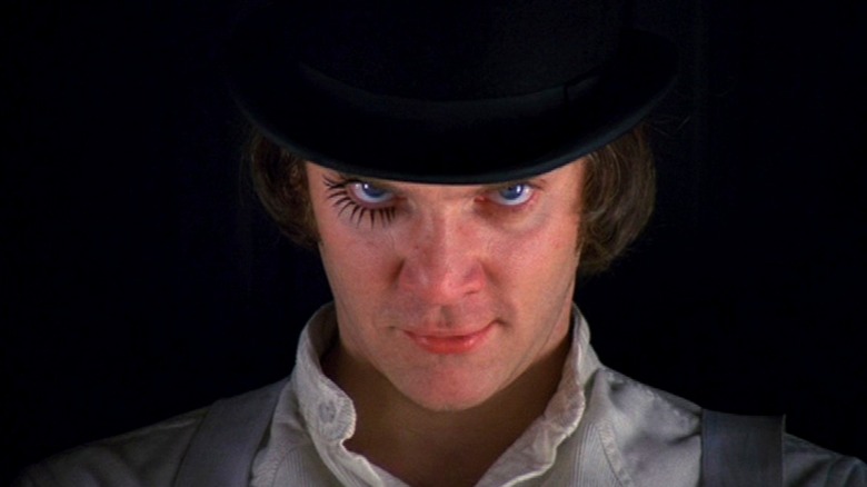 Malcolm McDowell smirking