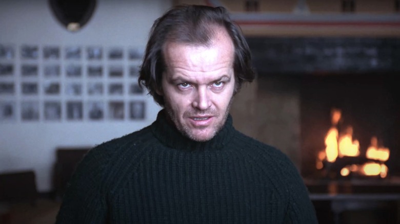 Jack Nicholson is starting to lose it as Jack Torrance in The Shining