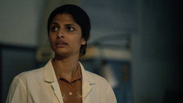 Priya Kansara as Lakshmi Chadha wearing a lab coat in Star City