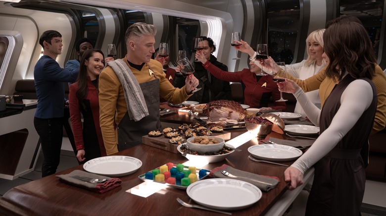 The crew of the U.S.S. Enterprise with Captain Pike in his kitchen on Star Trek: Strange New Worlds