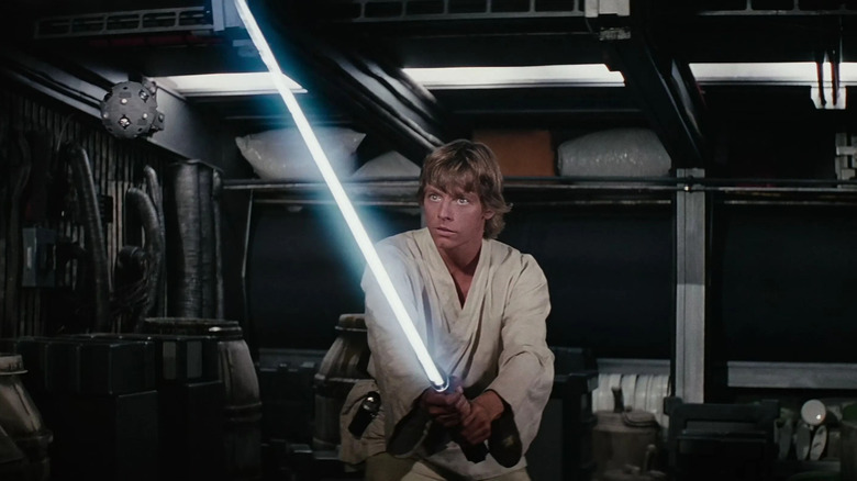 Luke Skywalker holding a lightsaber in Star Wars