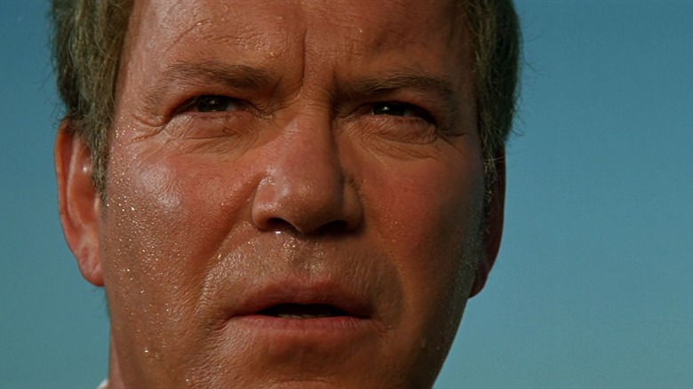 A close -up of a sweaty captain Kirk in Star Trek: generations.