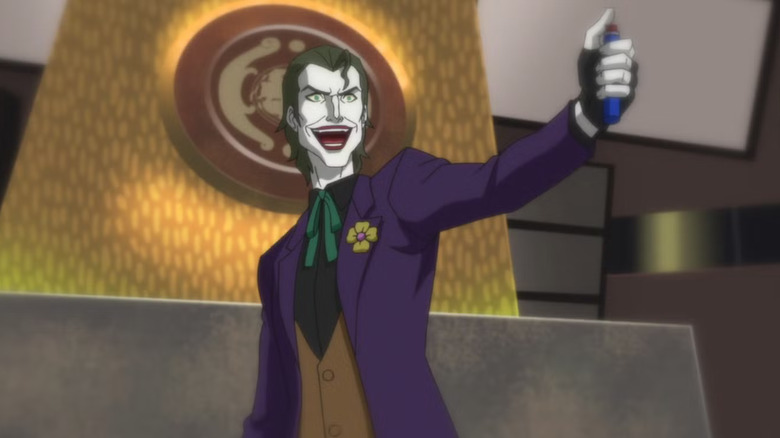 The Joker holding a button in his hand at the U.N. in Young Justice