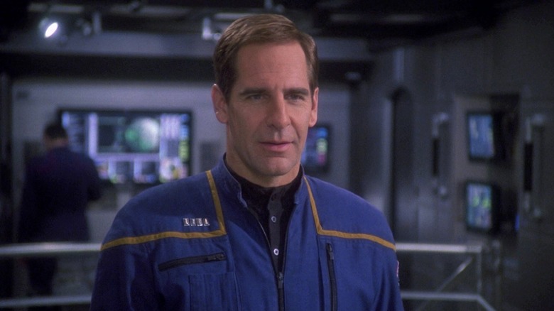 Scott Bakula's Captain Archer looking serious and wearing blue overalls on Star Trek: Enterprise