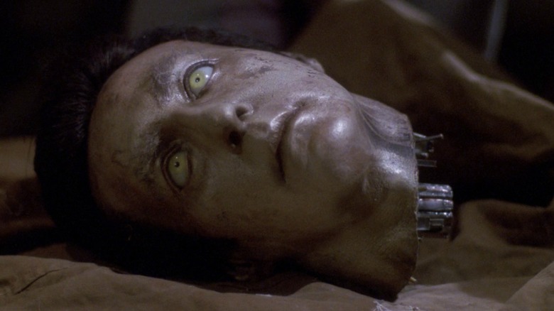 Data's severed head, which has creepy yellow eyes and shows signs of wear and tear, in Star Trek: The Next Generation