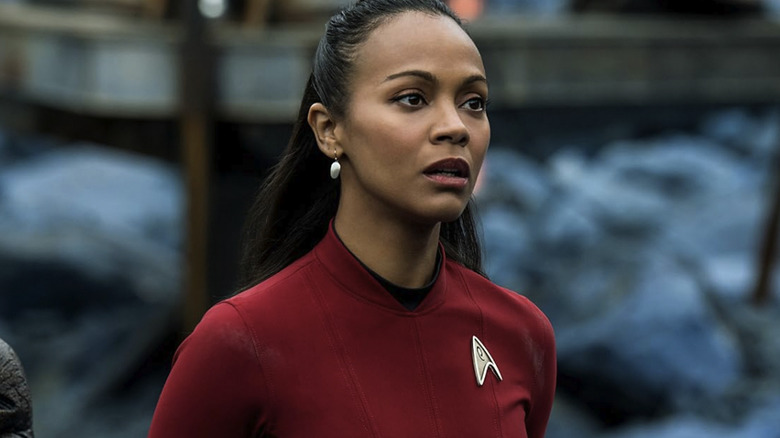 Uhura wearing red and looking at someone off screen in Star Trek Beyond