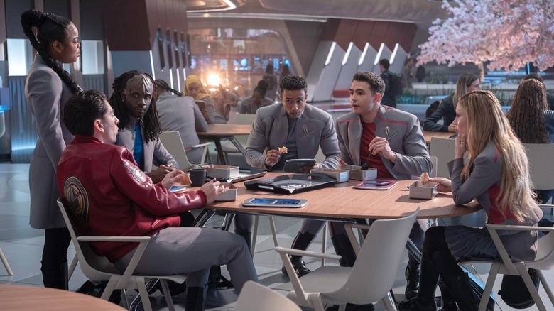 The young cadets sit around the lunch table, discussing their lives while dressed in uniform, in "Star Trek: Starfleet Academy"