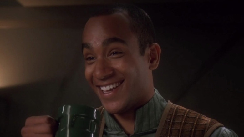 Jake Sisko holding up a drinking mug in Star Trek: Deep Space Nine