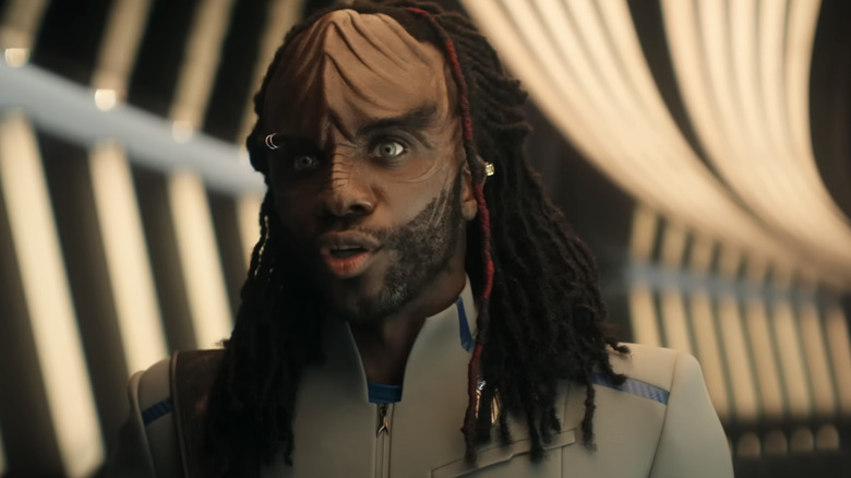 A Klingon looks at someone off screen in Starfleet Academy