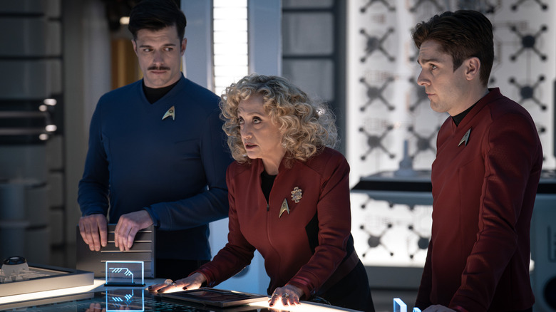 Sam Kirk, Pelia, and Scotty looking very concerned on Star Trek: Strange New Worlds