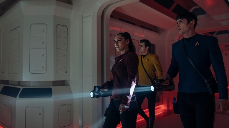 La'an, Kirk, and Spock with flashlights investigating the Griffin on Star Trek: Strange New Worlds