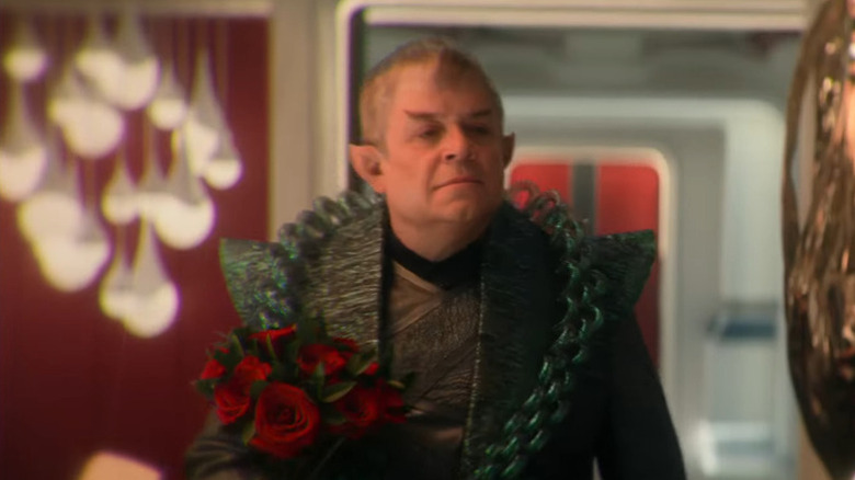 Doug holding a bouquet of roses on Star Trek: Strange New Worlds