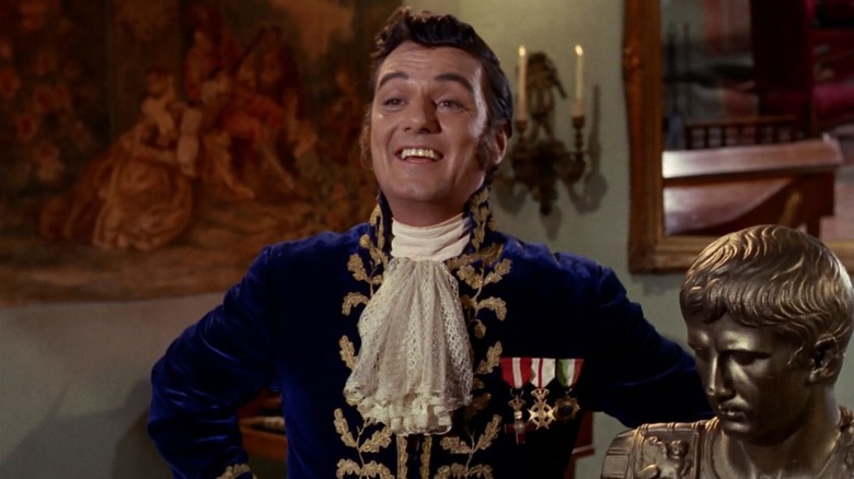 William Campbell as Trelane, smiling merrily, on Star Trek: The Next Generation