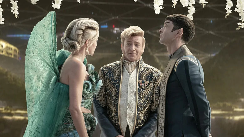 Jess Bush's Christine Chapel, Rhys Darby's Trelane, and Ethan Peck's Spock in formal clothing on Star Trek: Strange New Worlds