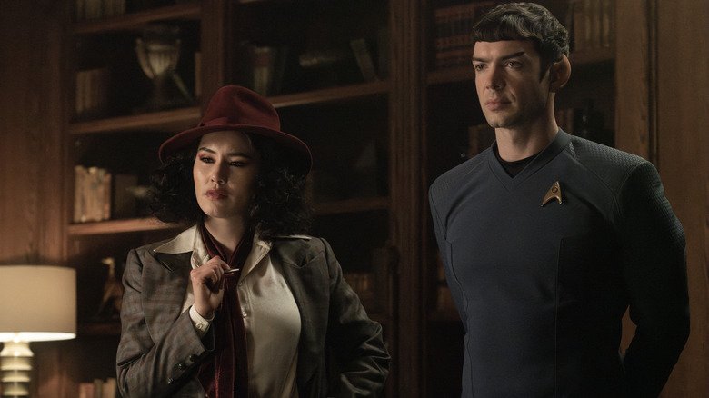 Lieutenant Noonien-Singh dressed as a detective, standing next to Spock, in uniform, on Star Trek: Strange New Worlds