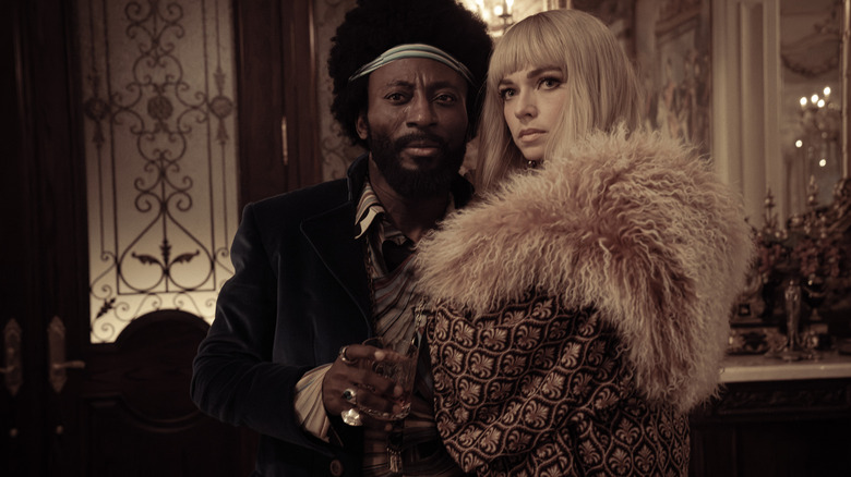 Holograms of Dr. M'Benga and Nurse Chapel, dressed in 1970s clothing on Star Trek: Strange New Worlds