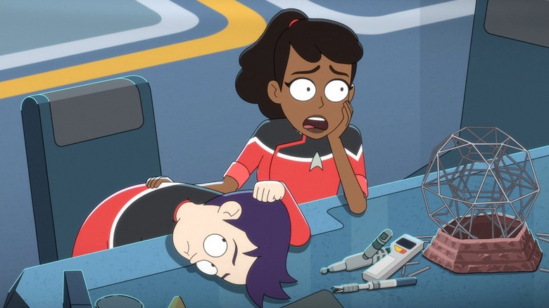 Boimler with his head on a desk and Mariner next to a Kal-toh set on Star Trek: Lower Decks