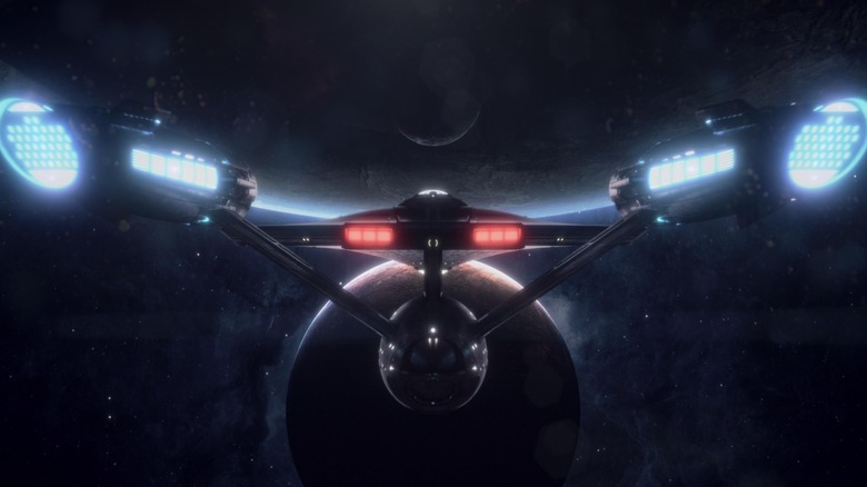 Rear view of the starship Enterprise in Star Trek: Strange New Worlds title sequence