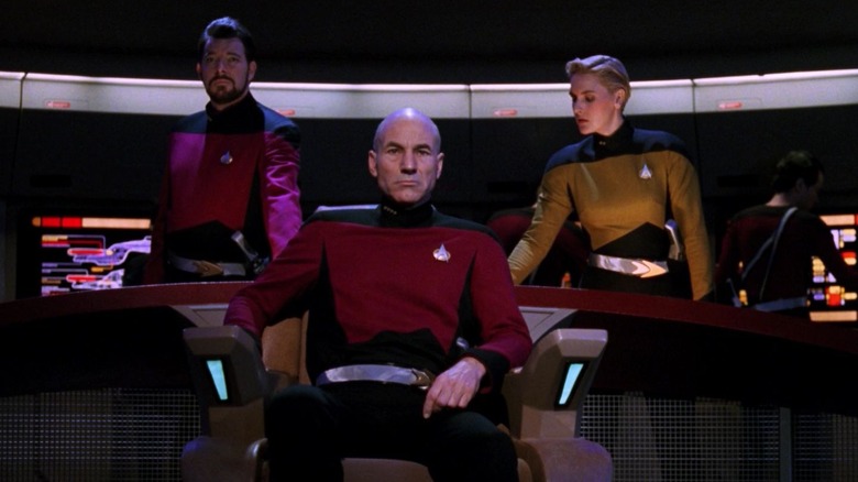 Picard flanked by Riker and Yar in a dark timeline on Star Trek: The Next Generation