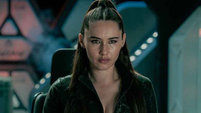 Christina Chong as La'an Noonien-Singh wearing an all-black outfit and sitting at the controls of a shuttlecraft in Star Trek: Strange New Worlds