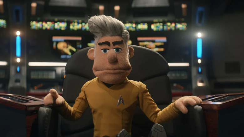 Captain Pike as a puppet, sitting in the captain's chair on Star Trek: Strange New Worlds